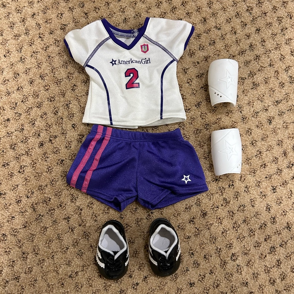 EUC American Girl Doll Soccer Outfit: shirt, shorts, shin guards, cleats.